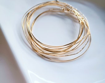 Irregular and hammered 14k laminated gold weekly bracelets