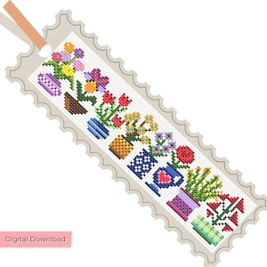 Puede incluir: Un marcapáginas rectangular con borde festoneado que presenta un patrón de punto de cruz de varias flores en macetas coloridas en tonos rojo, amarillo, azul, morado y verde. Una cinta color melocotón está unida a la parte superior. Dice Digital Download.