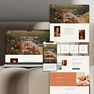 May include: A laptop, smartphone, and printouts display a website with the text "Where healing begins with YOU." The website features images of a woman and spa-related content. The color scheme is primarily beige and brown.