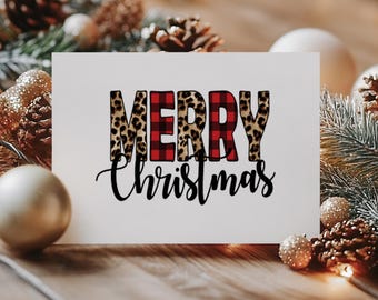 May include: A white card with the words "Merry Christmas" in black script. The word "Merry" is in red and black plaid and leopard print.