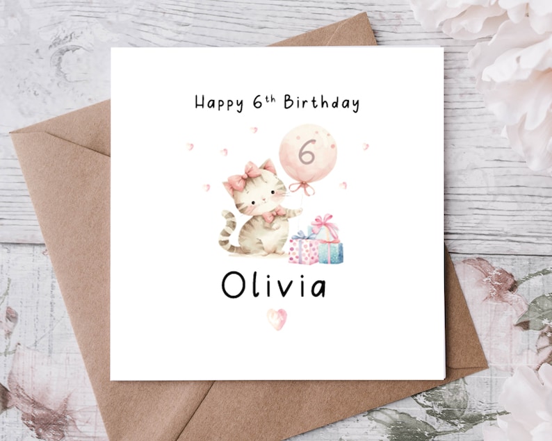 May include: A square birthday card with a watercolor illustration of a kitten holding a balloon with the number 6. The card reads "Happy 6th Birthday" and "Olivia". Presents and hearts decorate the card.