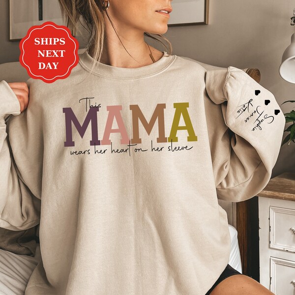 Custom This Mama Wears Her Heart On Her Sleeve Hoodie, Personalized Mom Sweatshirt With Kids Names, Cute Momma Outfit, Mothers Day