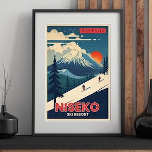 May include: Framed vintage travel poster for Niseko Ski Resort in Japan. The artwork features a mountain scene with skiers, a red sun, and text in English and Japanese. The poster is in a black frame.
