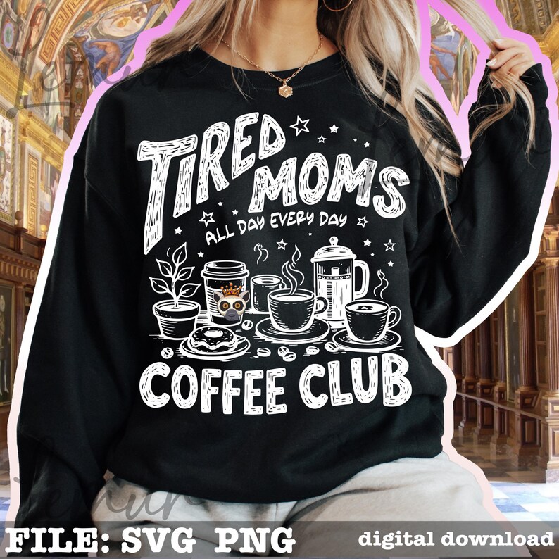 May include: Black sweatshirt featuring a white graphic with the text "Tired Moms Coffee Club" and coffee-themed illustrations. The design includes coffee cups, a coffee pot, and a donut. The phrase "All Day Every Day" is also present.