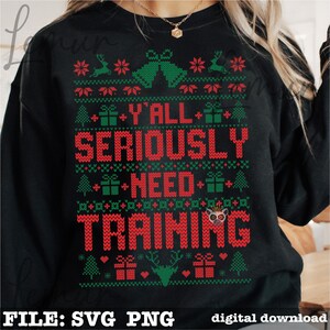 May include: Black sweatshirt with a festive Christmas design. The design includes red text that reads "Y'all Seriously Need Training" with green and red holiday graphics. The bottom of the sweatshirt has the text "FILE: SVG PNG" and "digital download".
