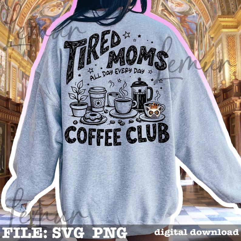 May include: Pale grey sweatshirt featuring the words "Tired Moms Coffee Club" in black. The design includes coffee cups, a coffee pot, a doughnut, and a potted plant. The phrase "All Day Every Day" is also included.