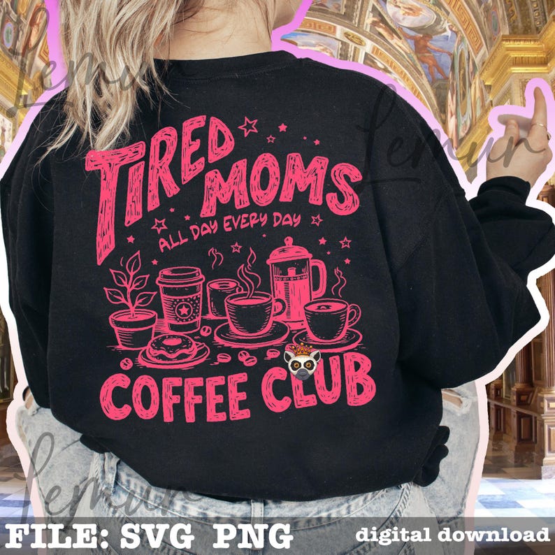 May include: Black sweatshirt with a pink graphic that reads "Tired Moms Coffee Club" with coffee-related illustrations. The text "All Day Every Day" is also included. The design features coffee cups, a coffee pot, and a donut.