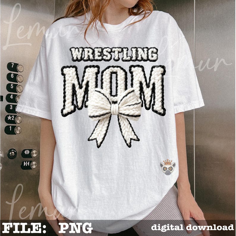 May include: White t-shirt with the text "WRESTLING MOM" in a black and white knitted design. A white bow with black trim is centered below the text. The shirt is a digital download.