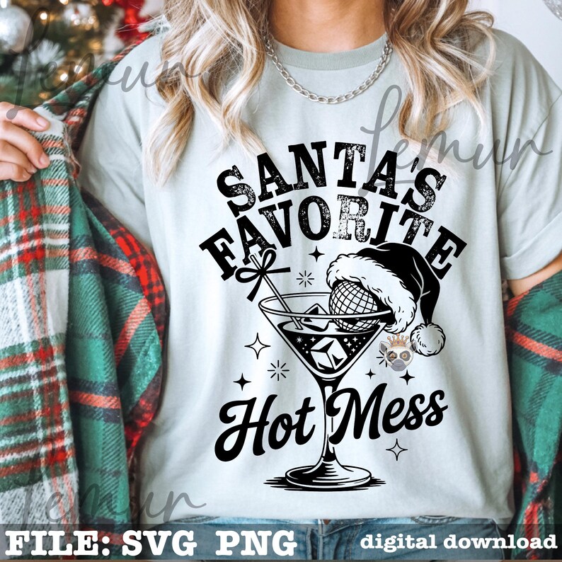 May include: A light green t-shirt with the text "SANTA'S FAVORITE HOT MESS" in black. The graphic features a cocktail glass with a Santa hat and a decorative bow. The shirt is part of a digital download.