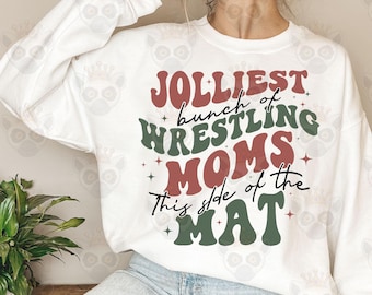 May include: White sweatshirt with a green and red graphic that says "Jolliest bunch of wrestling moms this side of the mat".