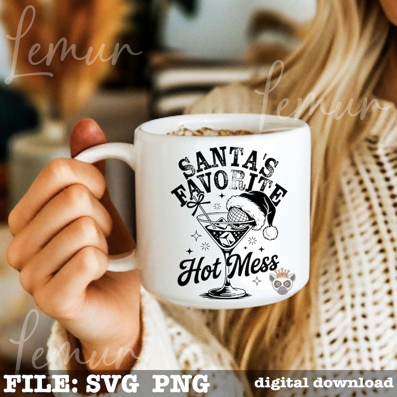 May include: White ceramic mug with the text "SANTA'S FAVORITE HOT MESS" in black. The design includes a martini glass with a Santa hat and stars. The mug is held by a person.