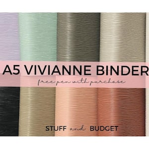 May include: A collection of A5 Viviane binders in various colors, including lavender, mint green, and black. The binders have a textured, ridged surface. The text "A5 Viviane Binders" is displayed prominently.
