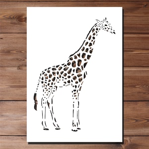 May include: A black and white silhouette of a giraffe with a spotted pattern. The giraffe is standing on a white background.