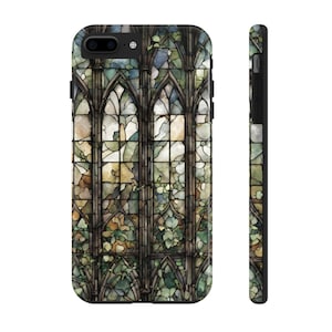 May include: A stained glass window phone case with a design of a window with green and brown vines. The window is made of colorful glass with a variety of colors including blue, green, yellow, and brown.