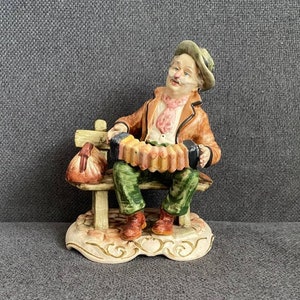 Capodimonte Figurine &quot;Man Tramp On Bench Playing Accordion&quot; 1980s