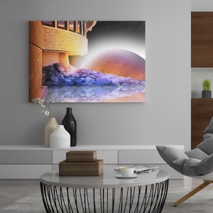 May include: A canvas print depicting a surreal landscape with a building, water, and a celestial body. The artwork features a color palette of orange, purple, and blue. The print is displayed above a modern living room setting.