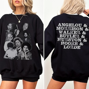 Puede incluir: Sudadera negra con un estampado gr&aacute;fico de varias mujeres en la parte delantera y el texto "ANGELO & MORRISON & WALKER & BUTLER & HURSTON & HOOKS & LORDE" en la parte trasera.