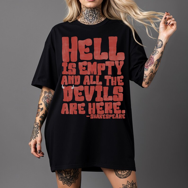 May include: Black t-shirt with the quote "HELL IS EMPTY AND ALL THE DEVILS ARE HERE." in red block letters, attributed to Shakespeare. The shirt is a casual, oversized style.