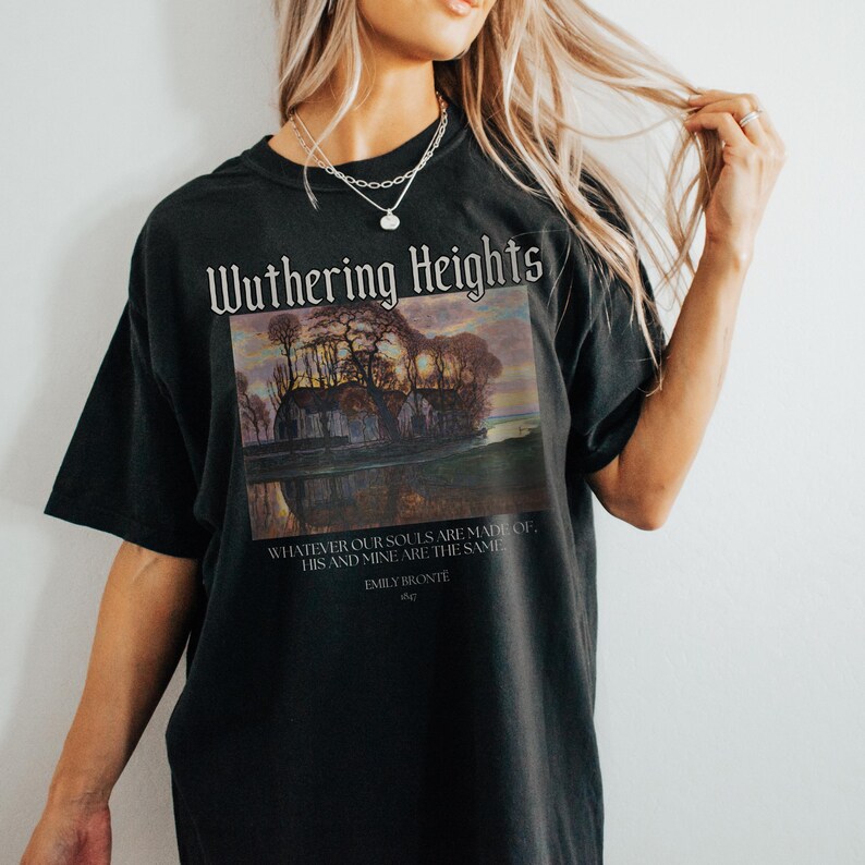 May include: Black t-shirt with a graphic print of a landscape scene and the text "Wuthering Heights" and a quote from the book by Emily Bronte.