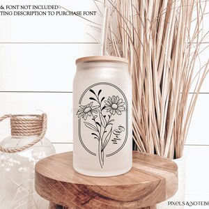 May include: A frosted glass tumbler with a bamboo lid and a black and white graphic of daisies with the word "molly" written inside a circle.