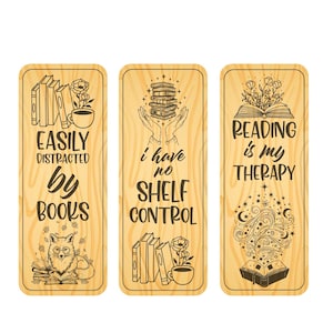 May include: Three wooden bookmarks with engraved designs and text. One says "Easily distracted by books" with a fox illustration. Another says "I have no shelf control." The third says "Reading is my therapy."