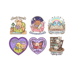 May include: A collection of six colorful stickers featuring cute cartoon animals reading books. The stickers include a bunny, bear, duck, butterfly, and two birds. Each sticker has text such as "book lover" and "Certified Cozy Reader".