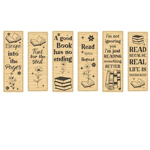 May include: Set of six wooden bookmarks with black text and floral illustrations. Each bookmark features a different quote about reading, such as "Escape into the Pages" and "A good Book has no ending."