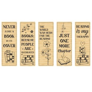 May include: Set of five wooden bookmarks with inspirational quotes and book-themed illustrations. Each bookmark features a different design, including text like "Never Judge a Book by Its Cover" and floral accents.