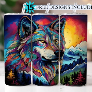 May include: Three stainless steel tumblers with a colorful abstract wolf design. The wolf's fur is a mix of blue, green, yellow, orange, and purple. The background of the tumblers features a mountain range and a sunset.