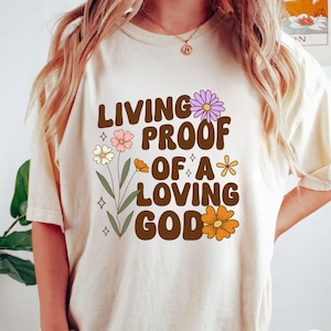 Maglietta da donna con fiori &quot;Prova vivente di un Dio amorevole&quot;, retro cristiano, fede, civetteria cristiana, religioso, versetto della Bibbia