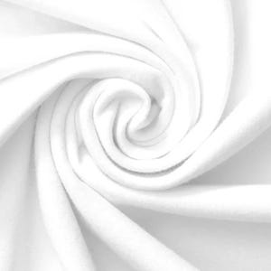 May include: A close-up shot of white fabric, tightly swirled to create a spiral pattern. The soft material has a smooth texture, with gentle shadows and highlights that emphasize the folds and curves of the fabric.