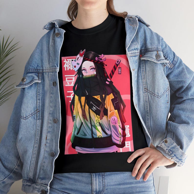 May include: Black t-shirt with a colorful illustration of a female anime character wearing a mask and a yellow jacket. The character is standing in front of a red and white background with Japanese text.
