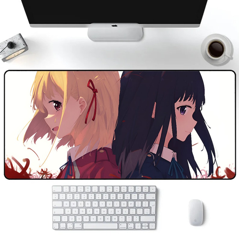 May include: A mousepad featuring an anime illustration of two girls with long hair. The girl on the left has blonde hair and is wearing a red and black uniform. The girl on the right has dark blue hair and is wearing a blue and black uniform.