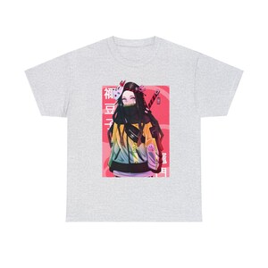 May include: A grey t-shirt with a graphic print of an anime character wearing a yellow and green jacket, a black mask, and holding a sword. The character is standing in front of a pink and white background with Japanese text that reads "胡蝶しのぶ".