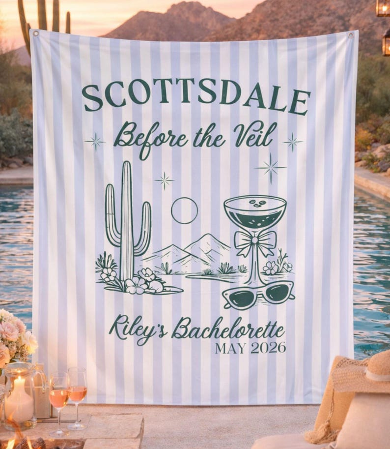 May include: A light blue and white striped backdrop with the text "SCOTTSDALE Before the Veil" and "Riley's Bachelorette MAY 2026". The backdrop features a desert-themed illustration with a cactus, mountains, and a cocktail.