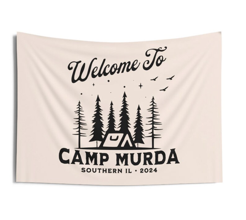 May include: A beige tapestry with black text that reads "Welcome to Camp Murda Southern IL. 2024". The design features a tent, trees, and stars.
