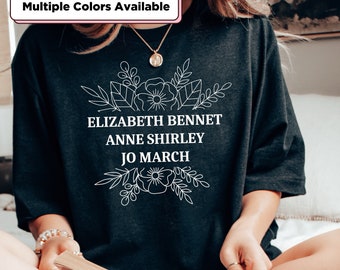 May include: Black t-shirt with white floral design and text that reads "Elizabeth Bennet Anne Shirley Jo March".