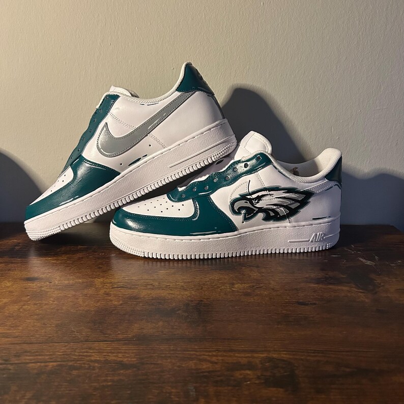 May include: A set of three ceramic mugs with a speckled, matte finish. The mugs are in shades of cream, light gray, and dark gray. Each mug has a simple, minimalist design, perfect for coffee or tea.