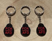 FCK AFD Einkaufswagenchip - mit rotem Schriftzug | Politischer Protest Schlüsselanhänger, Robuster Einkaufswagenlöser gegen Rechtspopulismus
