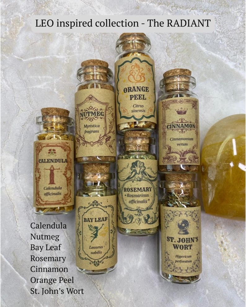 May include: Seven small glass jars with cork stoppers, each containing dried herbs or spices labeled Calendula, Nutmeg, Orange Peel, Cinnamon, Bay Leaf, Rosemary, and St. John's Wort. The set is titled LEO inspired collection - The RADIANT.