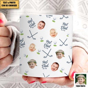 May include: White ceramic mug with a repeating pattern of golf clubs, golf balls, and baby faces. The words "Best Dad By Par" are also printed on the mug. The text "TEXT & PHOTO CAN BE CHANGED" is at the top.