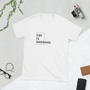 May include: White t-shirt with black text that reads "CSS IS AWESOME" inside a black rectangle.