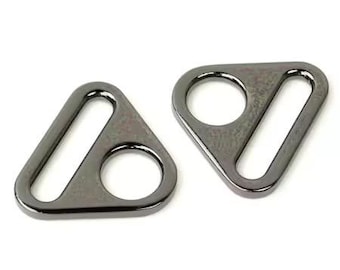 May include: Two black triangle-shaped metal rings with a rectangular opening. The rings are smooth and have a shiny finish.