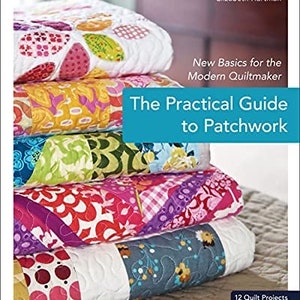 May include: A book titled "The Practical Guide to Patchwork" by Elizabeth Hartman. The book cover features a stack of colorful patchwork quilts with a blue title bar and the text "New Basics for the Modern Quiltmaker".