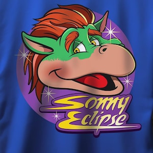 May include: A royal blue t-shirt with a cartoon character wearing a green and red hat. The character has a large smile and is surrounded by stars. The text "Sonny Eclipse" is written in yellow and white letters.