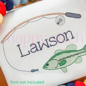 May include: Embroidered design of a fishing rod and reel with a bass fish, and the name "Lawson" in a cursive font. The design is on a white fabric background.