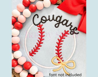 May include: A blue and white baseball-themed embroidery design with the word "Cougars" in black cursive lettering. The design includes a red and white baseball with a yellow bow.