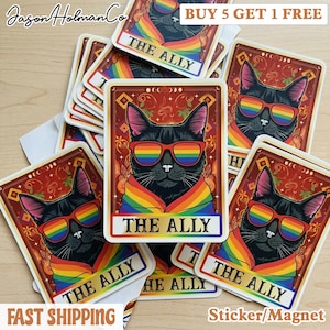 May include: A collection of stickers featuring a black cat wearing rainbow sunglasses and a rainbow scarf. The cat is set against a red background with the text "THE ALLY". The stickers are labeled "Sticker/Magnet".