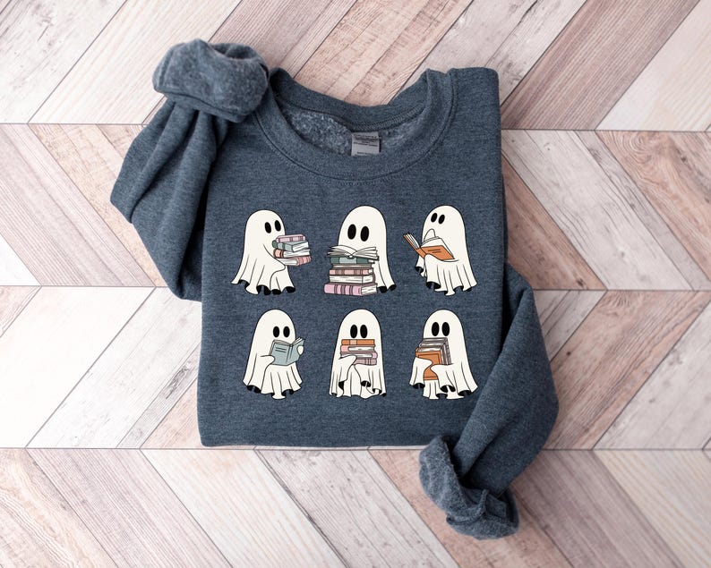 a group of ghost sweaters sitting on top of a wooden floor