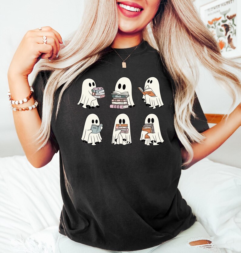 a woman wearing a black shirt with ghost on it